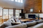 Vaulted ceilings and large windows create an open feel